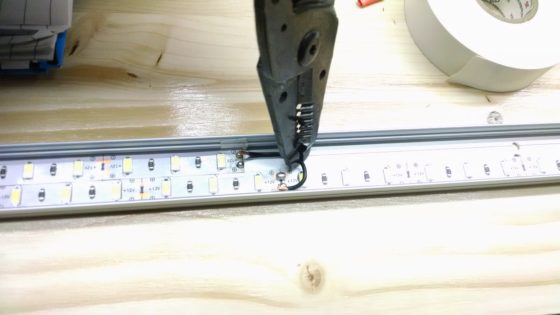 LED strip lighting - wire soldered in channel - holding with stripper