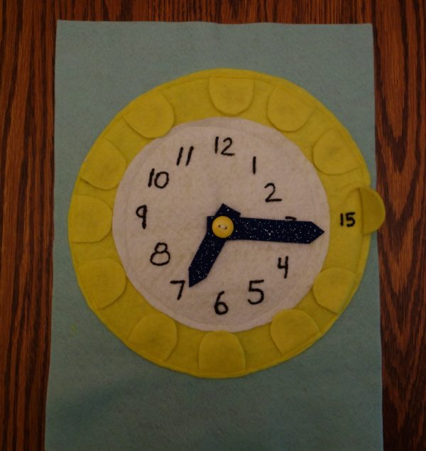 Cloth "Quiet Book" Pages, from Holly's latest hand-made children's activity books - Clock page: Tell Time and What do Clock Hands do? activity
