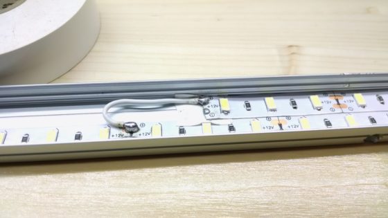 LED strip lighting - wire soldered in channel, doubled, staggered with electrical tape